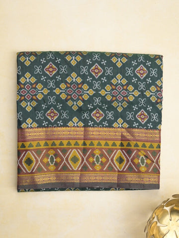 Ikkath fancy saree in dark green color allover design with zari border & ikkath pallu and plain blouse