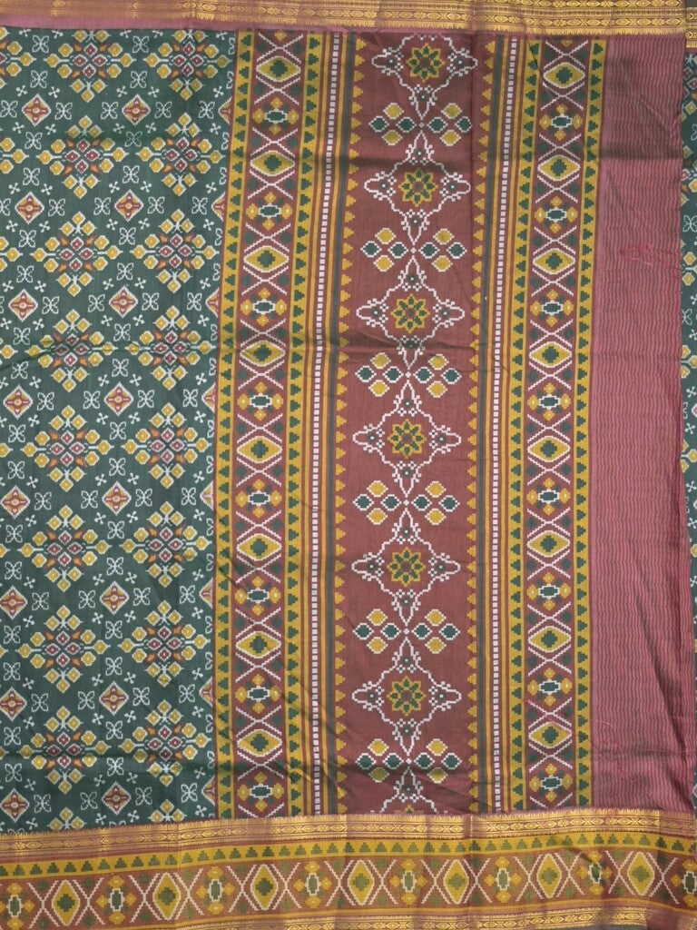 Ikkath fancy saree in dark green color allover design with zari border & ikkath pallu and plain blouse