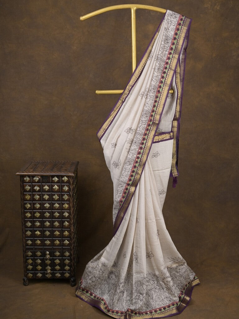 Maheshwari fancy saree in white color with allover prints & zari border with short pallu and contrast blouse