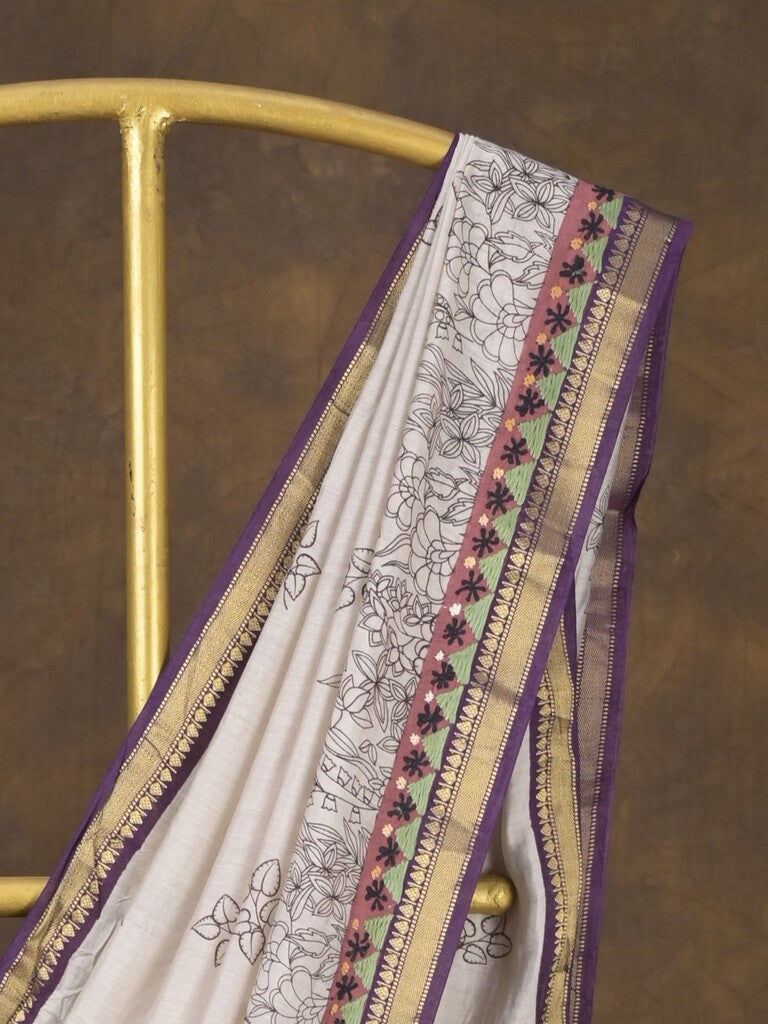 Maheshwari fancy saree in white color with allover prints & zari border with short pallu and contrast blouse