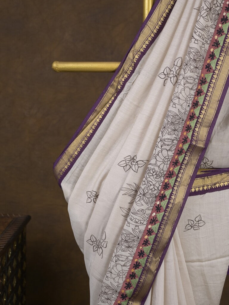 Maheshwari fancy saree in white color with allover prints & zari border with short pallu and contrast blouse