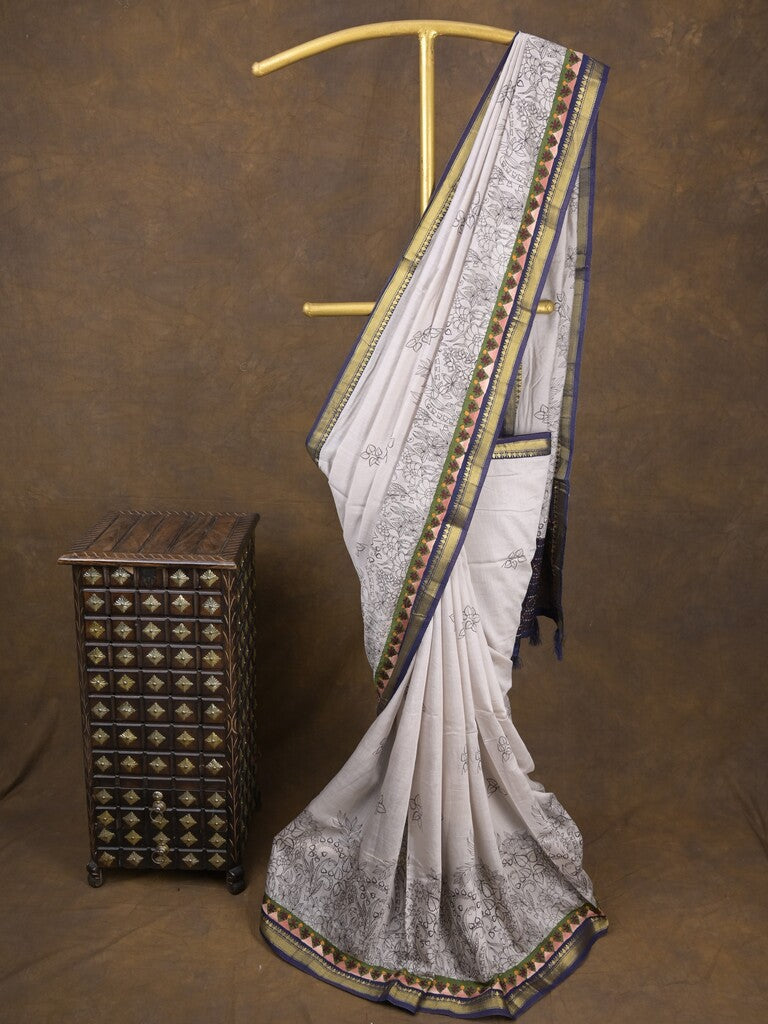 Maheshwari fancy saree in white color with allover prints & zari border with short pallu and contrast blouse
