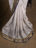 Maheshwari fancy saree in white color with allover prints & zari border with short pallu and contrast blouse