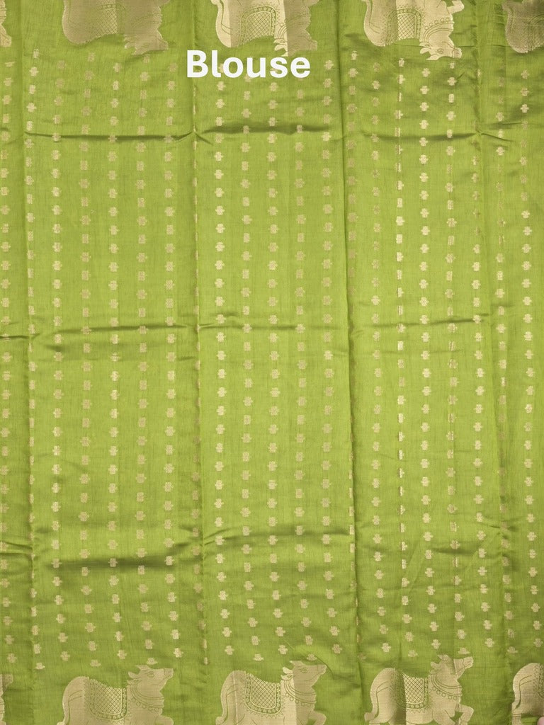Dupion fancy saree parrot green color allover zari motifs & zari border with rich pallu and running blouse