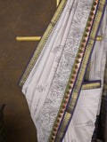 Maheshwari fancy saree in white color with allover prints & zari border with short pallu and contrast blouse