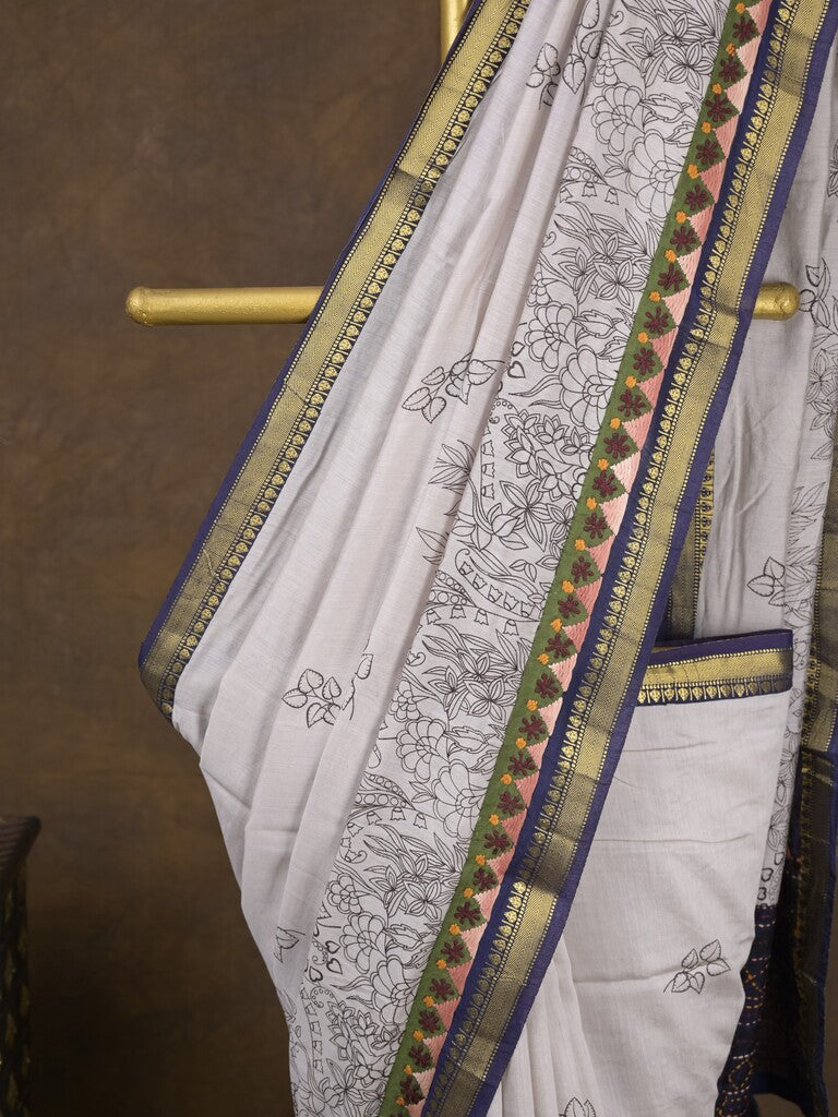 Maheshwari fancy saree in white color with allover prints & zari border with short pallu and contrast blouse