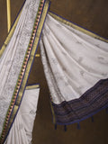 Maheshwari fancy saree in white color with allover prints & zari border with short pallu and contrast blouse