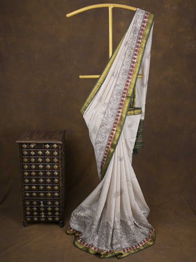 Maheshwari fancy saree in white color with allover prints & zari border with short pallu and contrast blouse