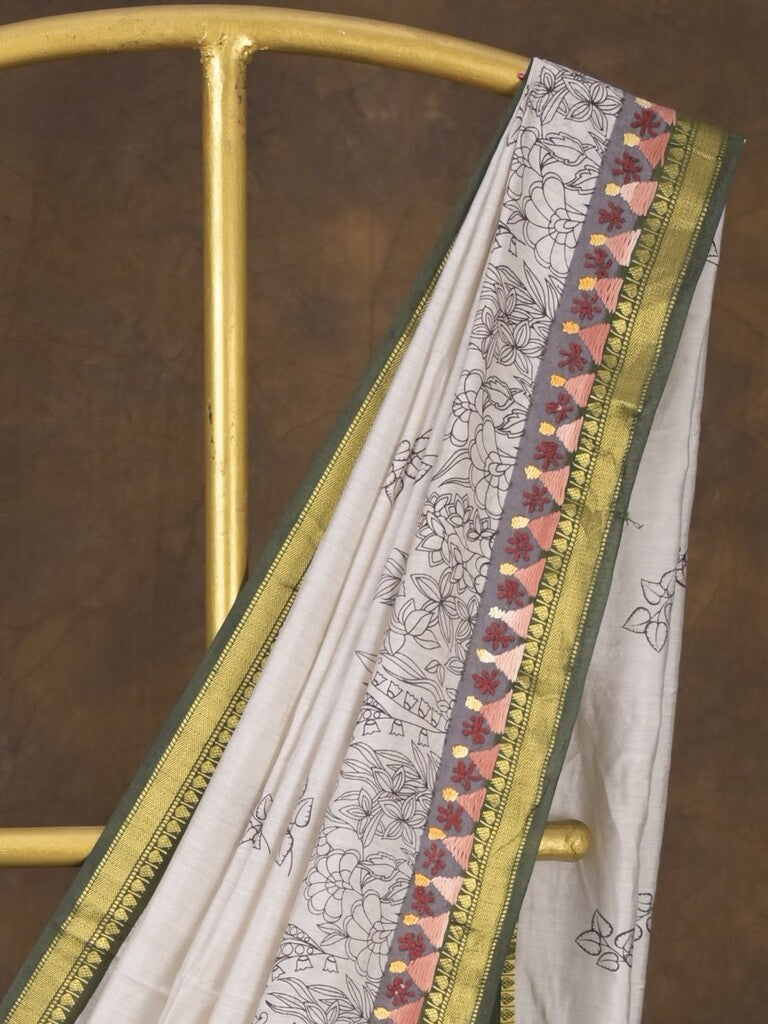 Maheshwari fancy saree in white color with allover prints & zari border with short pallu and contrast blouse