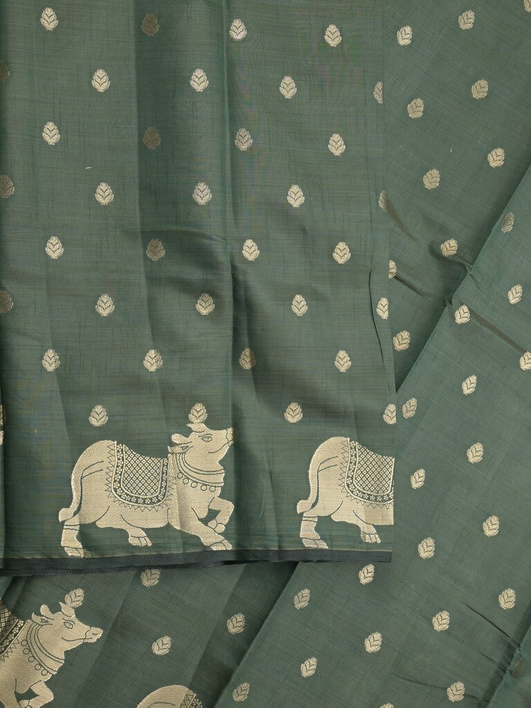 Dupion fancy saree dark green color allover zari motifs & zari border with rich pallu and running blouse