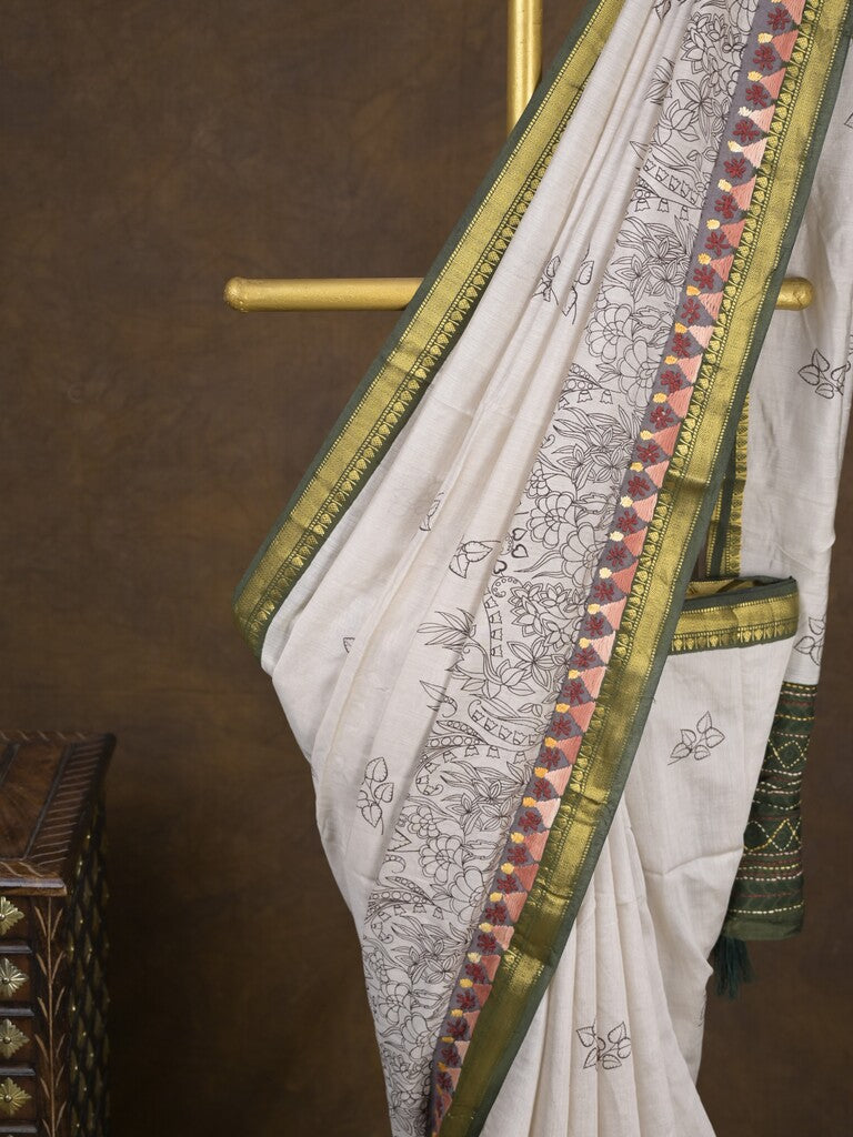 Maheshwari fancy saree in white color with allover prints & zari border with short pallu and contrast blouse