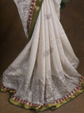 Maheshwari fancy saree in white color with allover prints & zari border with short pallu and contrast blouse