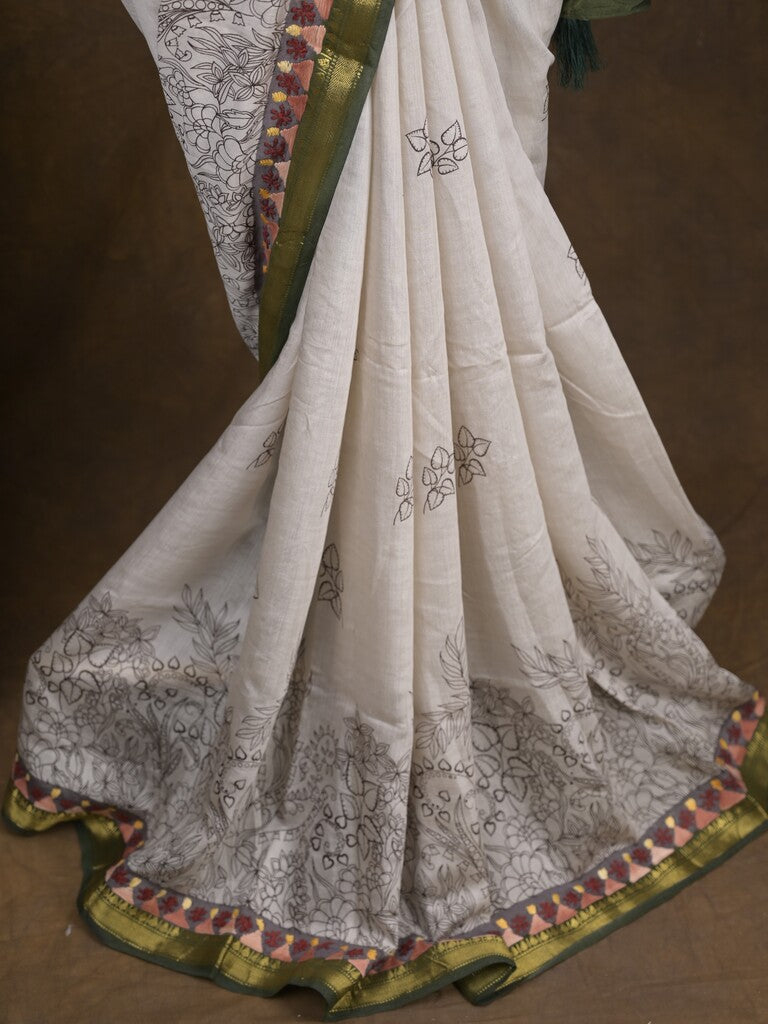 Maheshwari fancy saree in white color with allover prints & zari border with short pallu and contrast blouse