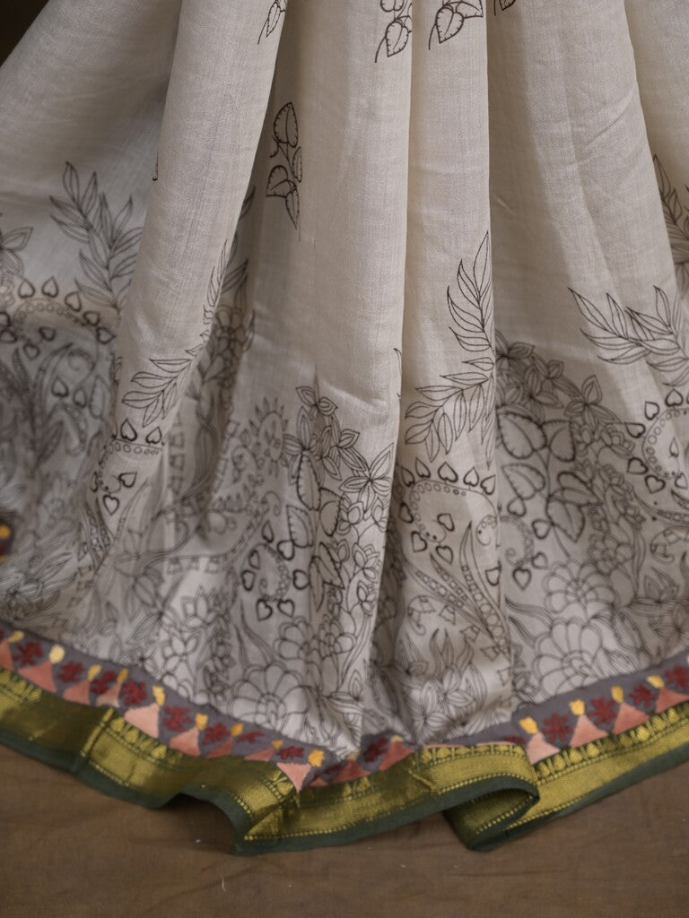 Maheshwari fancy saree in white color with allover prints & zari border with short pallu and contrast blouse