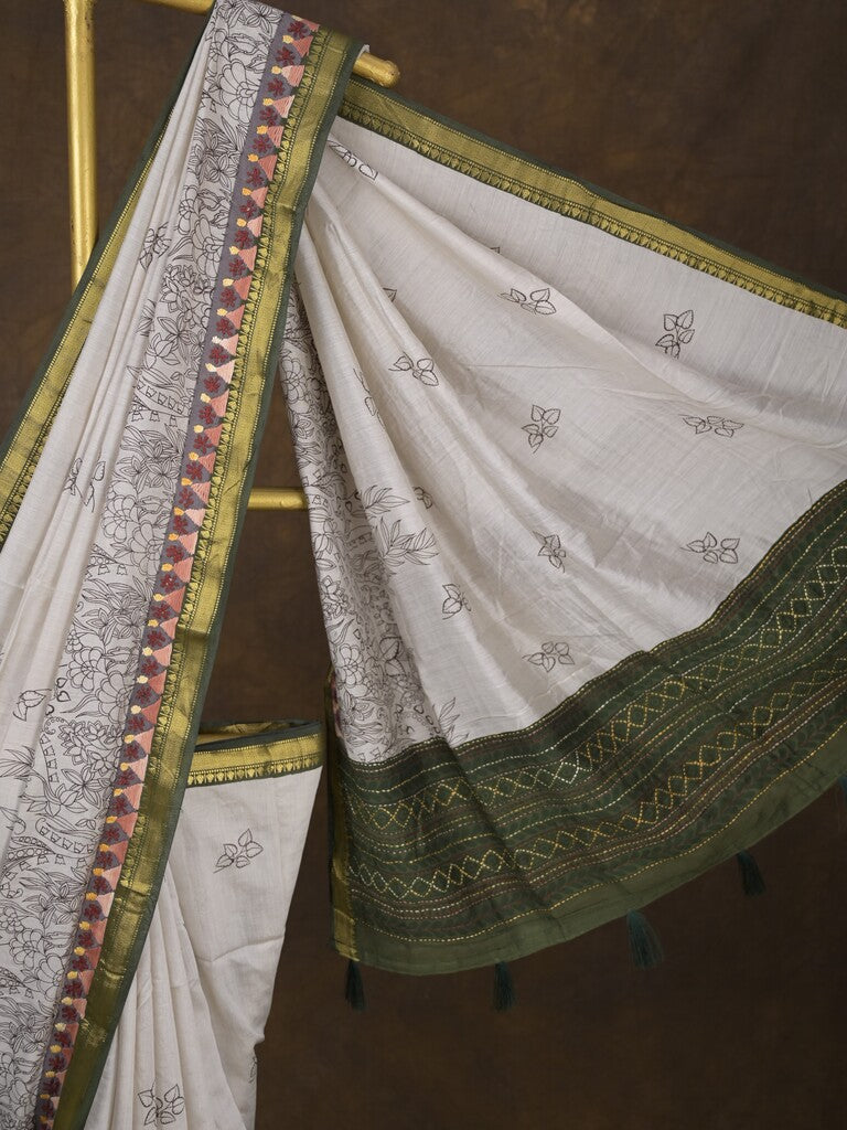 Maheshwari fancy saree in white color with allover prints & zari border with short pallu and contrast blouse