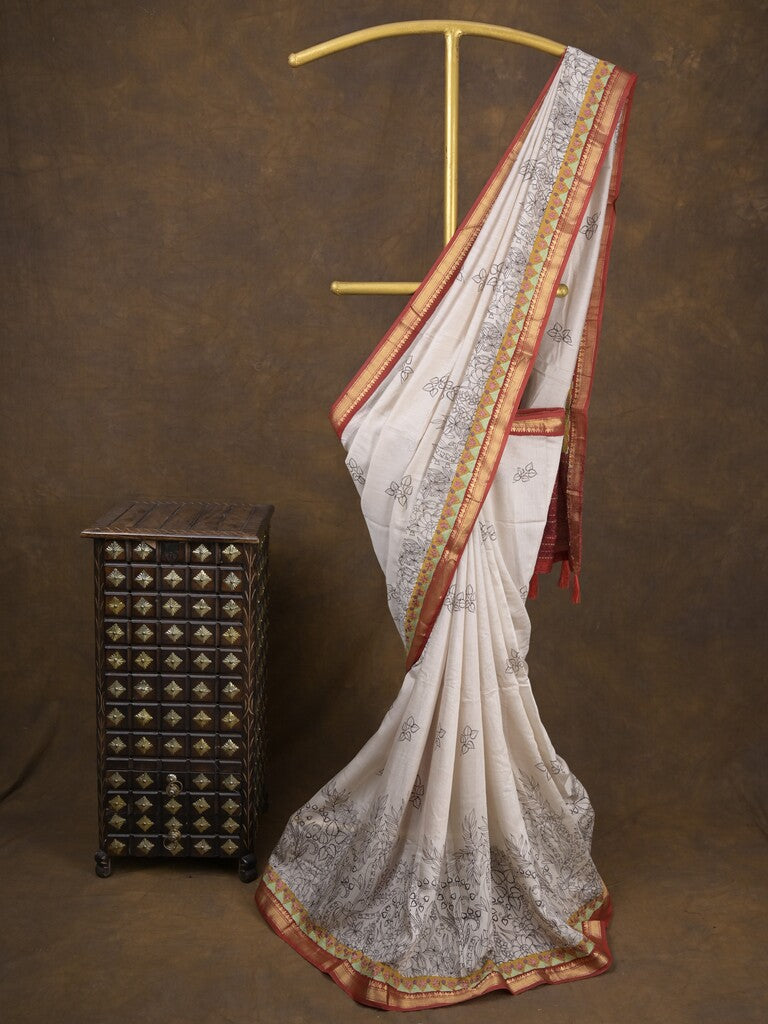 Maheshwari fancy saree in white color with allover prints & zari border with short pallu and contrast blouse