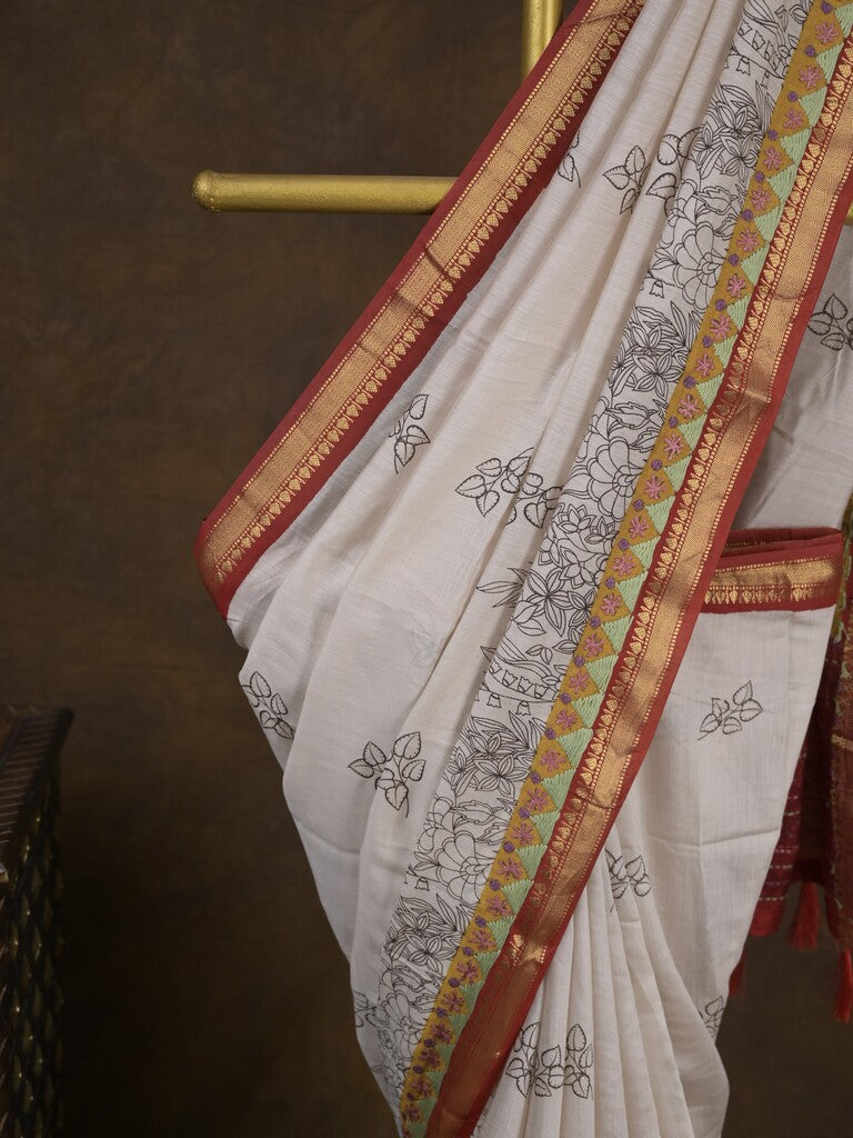 Maheshwari fancy saree in white color with allover prints & zari border with short pallu and contrast blouse