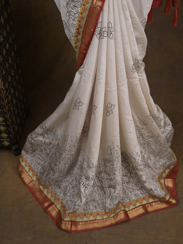 Maheshwari fancy saree in white color with allover prints & zari border with short pallu and contrast blouse