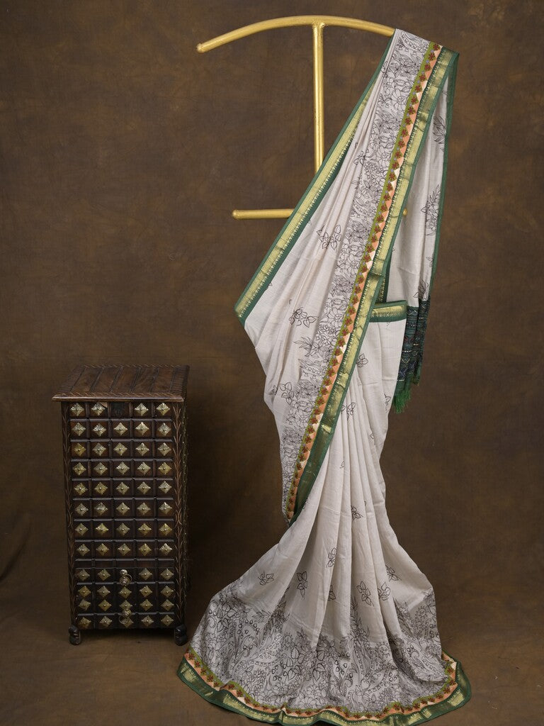 Maheshwari fancy saree in white color with allover prints & zari border with short pallu and contrast blouse