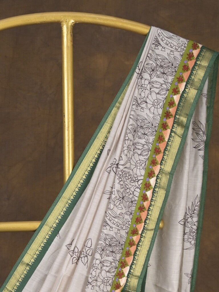 Maheshwari fancy saree in white color with allover prints & zari border with short pallu and contrast blouse