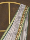 Maheshwari fancy saree in white color with allover prints & zari border with short pallu and contrast blouse