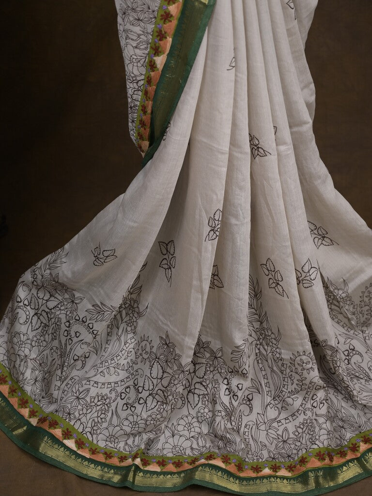 Maheshwari fancy saree in white color with allover prints & zari border with short pallu and contrast blouse
