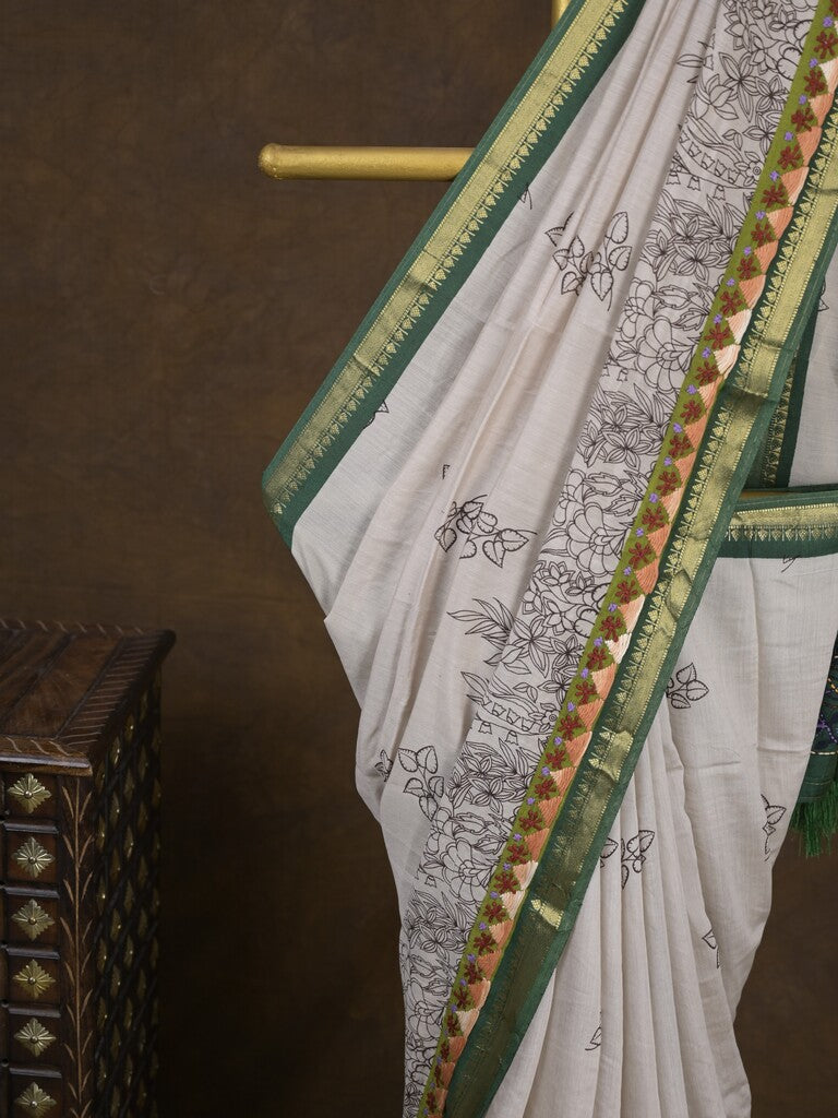 Maheshwari fancy saree in white color with allover prints & zari border with short pallu and contrast blouse