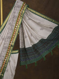 Maheshwari fancy saree in white color with allover prints & zari border with short pallu and contrast blouse