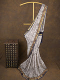 Maheshwari fancy saree in white color with allover prints & zari border with short pallu and contrast blouse