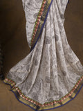 Maheshwari fancy saree in white color with allover prints & zari border with short pallu and contrast blouse