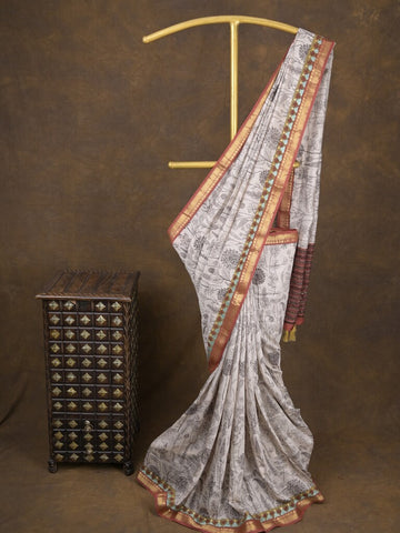 Maheshwari fancy saree in white color with allover prints & zari border with short pallu and contrast blouse