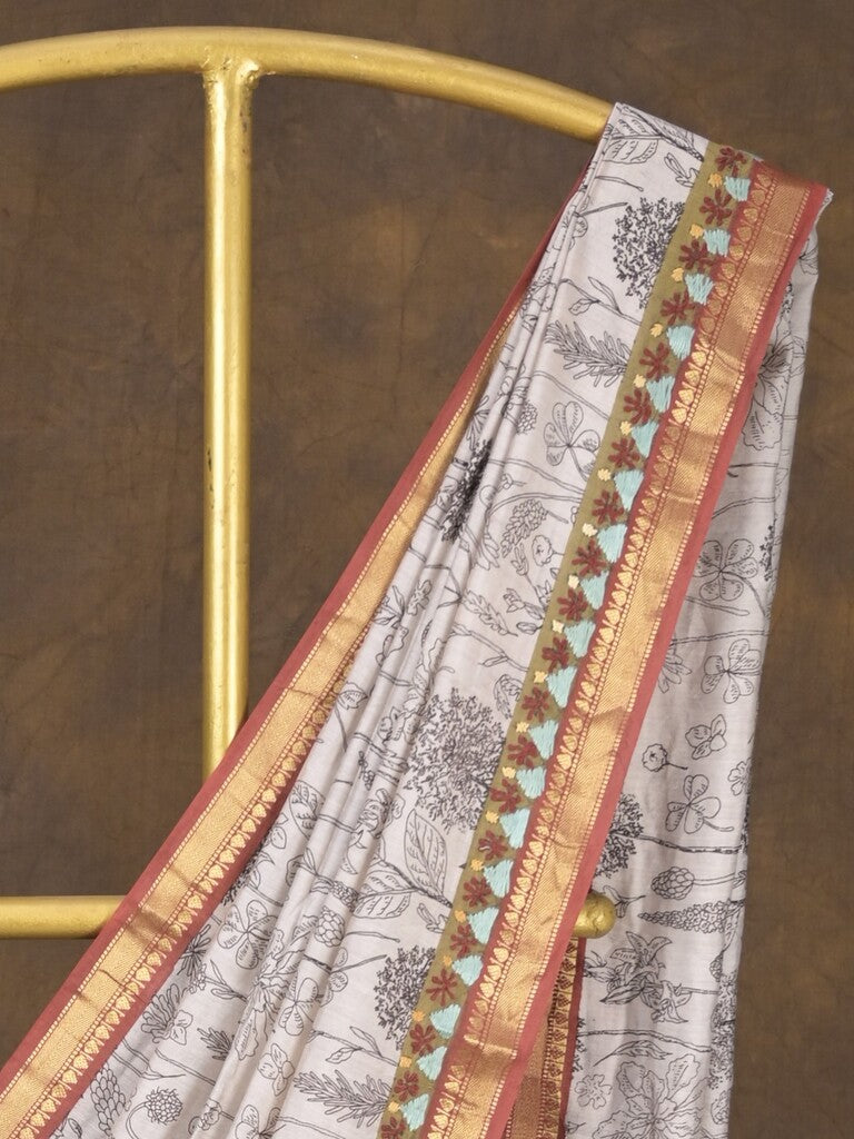 Maheshwari fancy saree in white color with allover prints & zari border with short pallu and contrast blouse