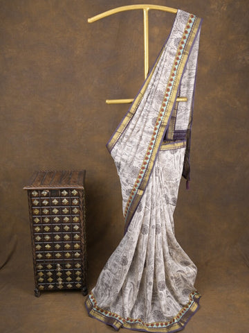 Maheshwari fancy saree in white color with allover prints & zari border with short pallu and contrast blouse