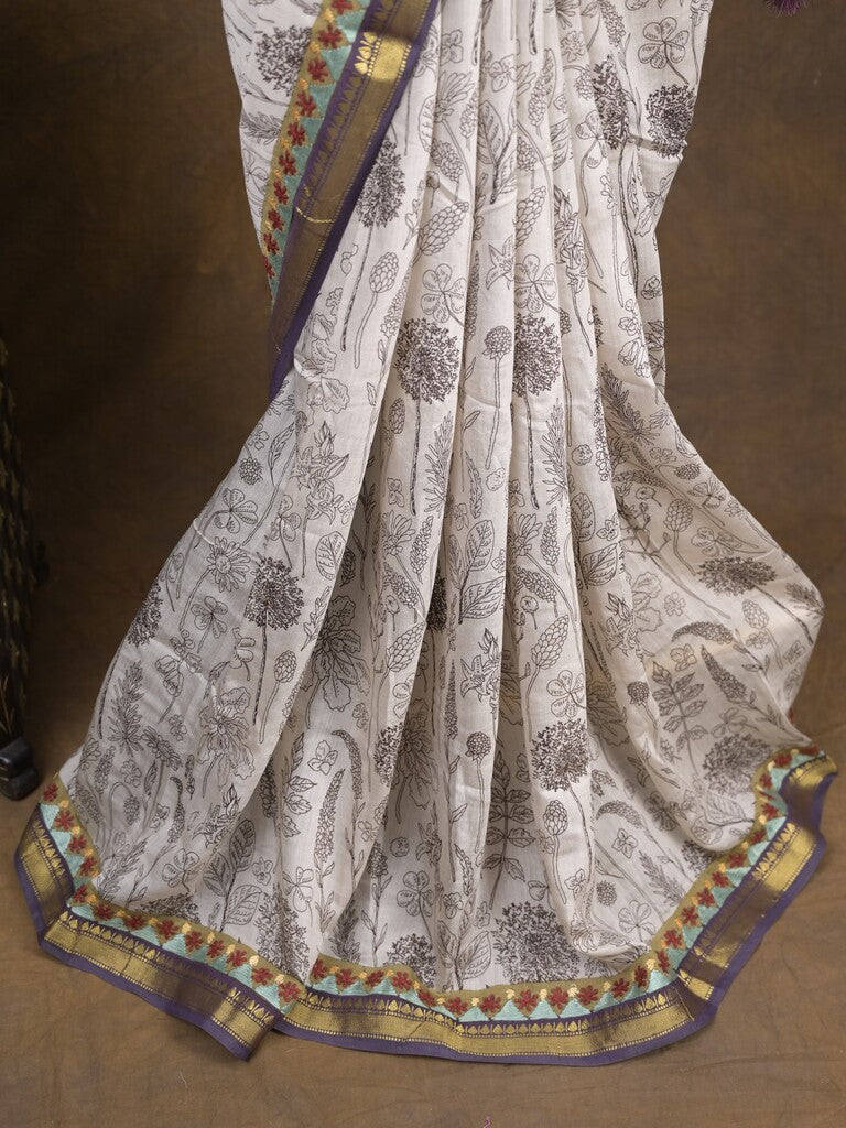 Maheshwari fancy saree in white color with allover prints & zari border with short pallu and contrast blouse