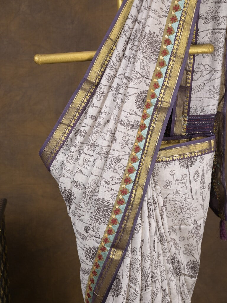 Maheshwari fancy saree in white color with allover prints & zari border with short pallu and contrast blouse