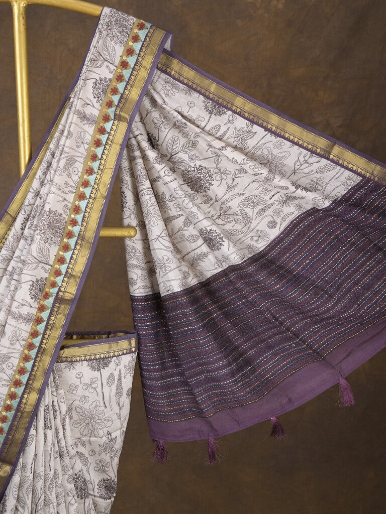 Maheshwari fancy saree in white color with allover prints & zari border with short pallu and contrast blouse