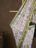 Maheshwari fancy saree in white color with allover prints & zari border with short pallu and contrast blouse