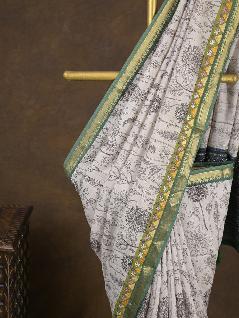 Maheshwari fancy saree in white color with allover prints & zari border with short pallu and contrast blouse