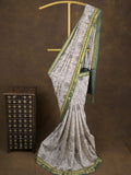 Maheshwari fancy saree in white color with allover prints & zari border with short pallu and contrast blouse