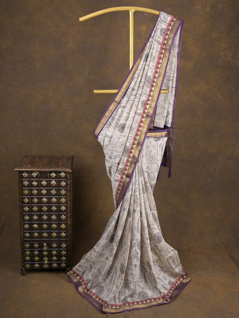 Maheshwari fancy saree in white color with allover prints & zari border with short pallu and contrast blouse
