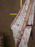 Maheshwari fancy saree in white color with allover prints & zari border with short pallu and contrast blouse