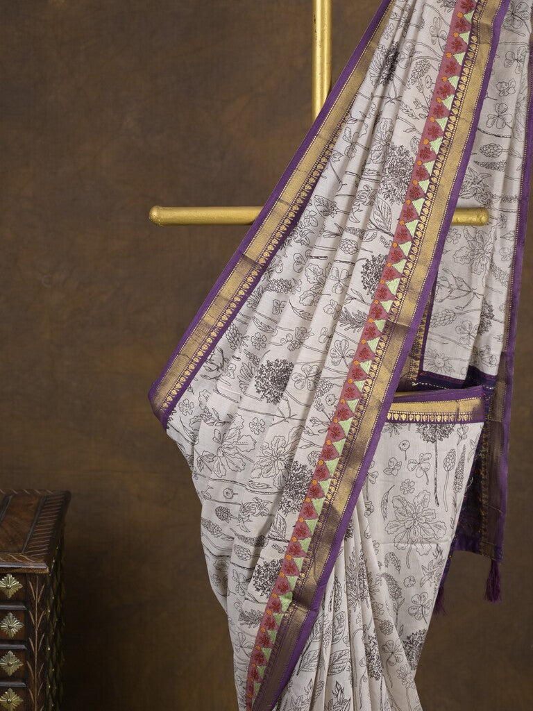 Maheshwari fancy saree in white color with allover prints & zari border with short pallu and contrast blouse