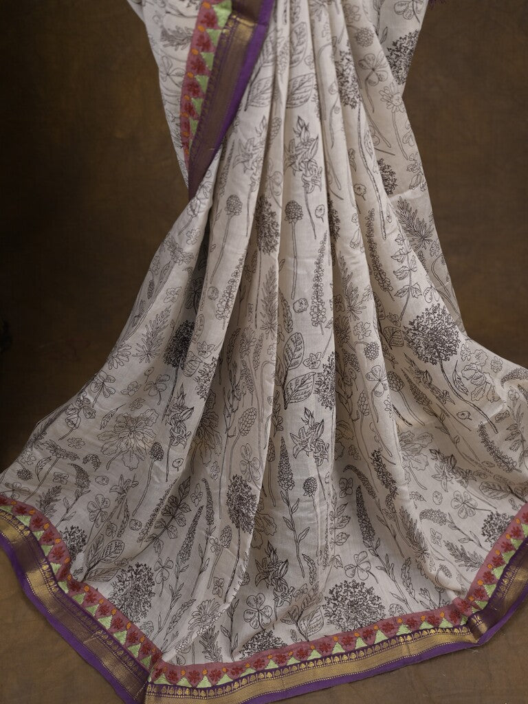 Maheshwari fancy saree in white color with allover prints & zari border with short pallu and contrast blouse