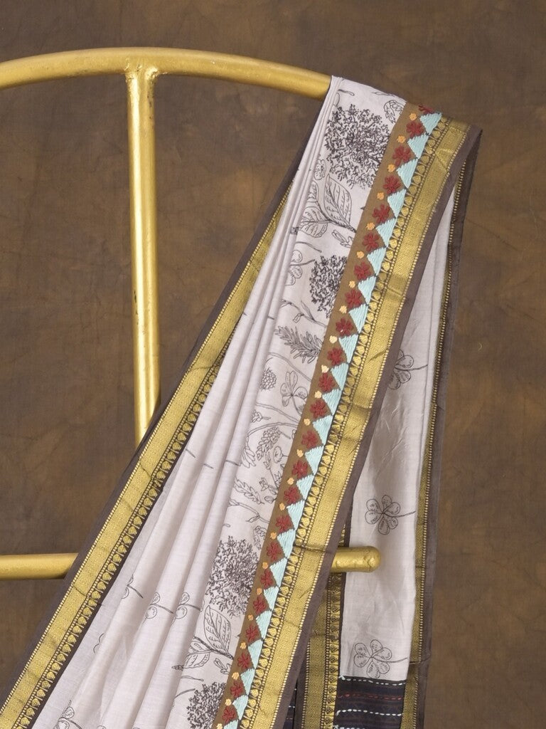 Maheshwari fancy saree in white color with allover prints & zari border with short pallu and contrast blouse