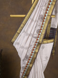 Maheshwari fancy saree in white color with allover prints & zari border with short pallu and contrast blouse