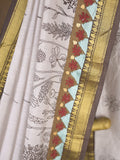 Maheshwari fancy saree in white color with allover prints & zari border with short pallu and contrast blouse