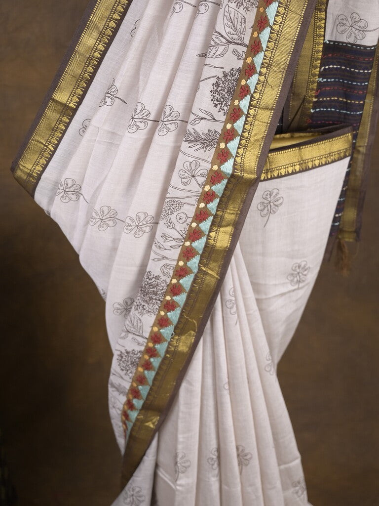 Maheshwari fancy saree in white color with allover prints & zari border with short pallu and contrast blouse
