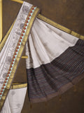 Maheshwari fancy saree in white color with allover prints & zari border with short pallu and contrast blouse