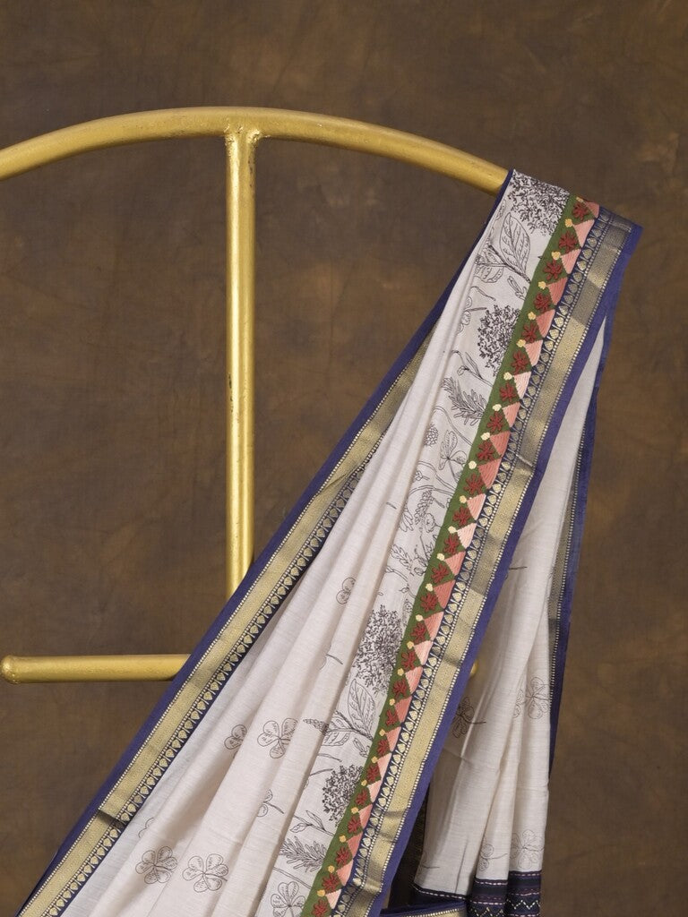 Maheshwari fancy saree in white color with allover prints & zari border with short pallu and contrast blouse
