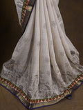Maheshwari fancy saree in white color with allover prints & zari border with short pallu and contrast blouse